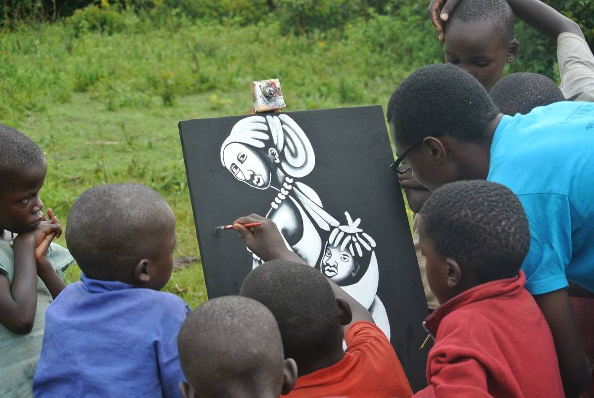 Children gathered around an art board at the Martens Africa Center