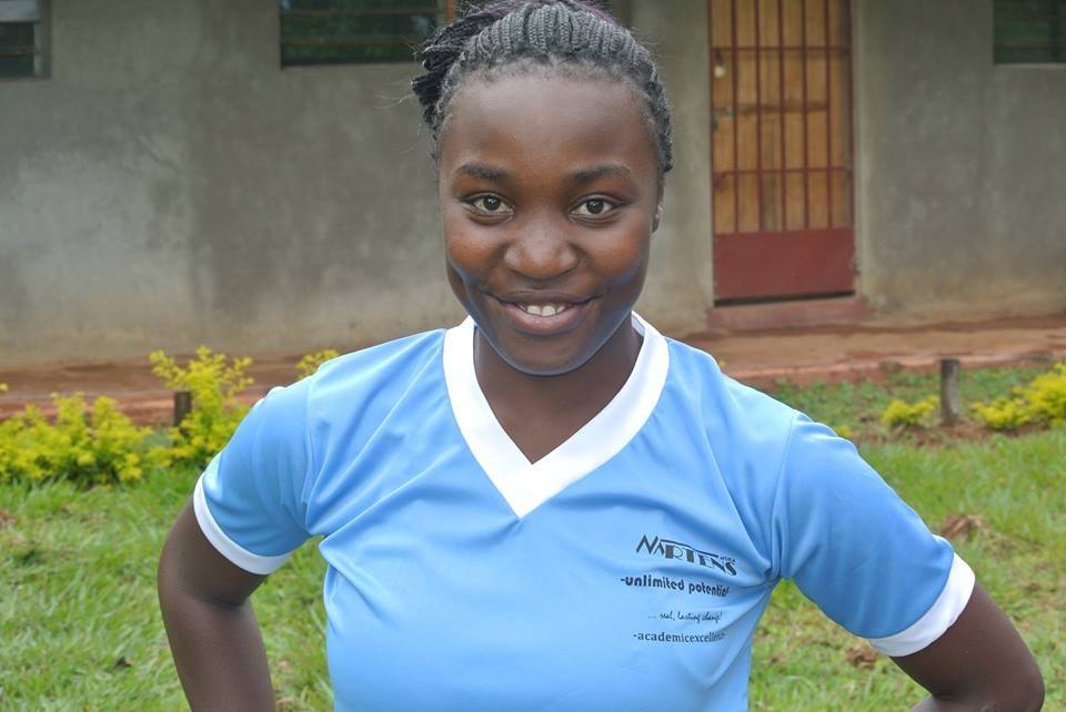 Smiling young woman in a Martens Africa t-shirt