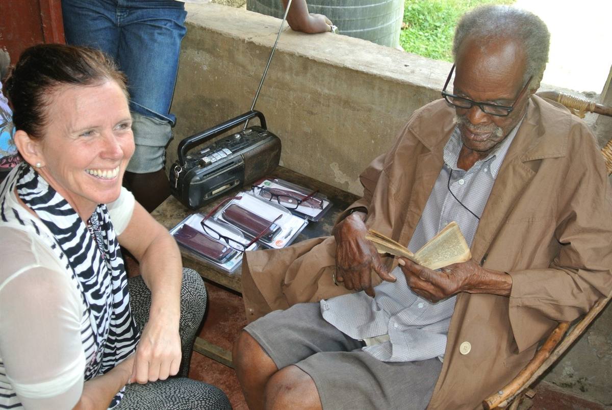 An international volunteer with a community elder